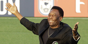 FILE - In this Aug. 3, 2013, file photo, Brazilian soccer legend Pele waves to the crowd during a pregrame cereomy before an NASL soccer game between the New York Cosmos and the Fort Lauderdale Strikers in Hempstead, N.Y. Pele will watching, not playing, when two franchises that helped get soccer rolling in this country renew acquaintances. The Brazilian great's former team, the Cosmos, visit the Strikers on Saturday, rekindling memories of how more than 70,000 fans used to see them play. (AP Photo/Frank Franklin II, File)